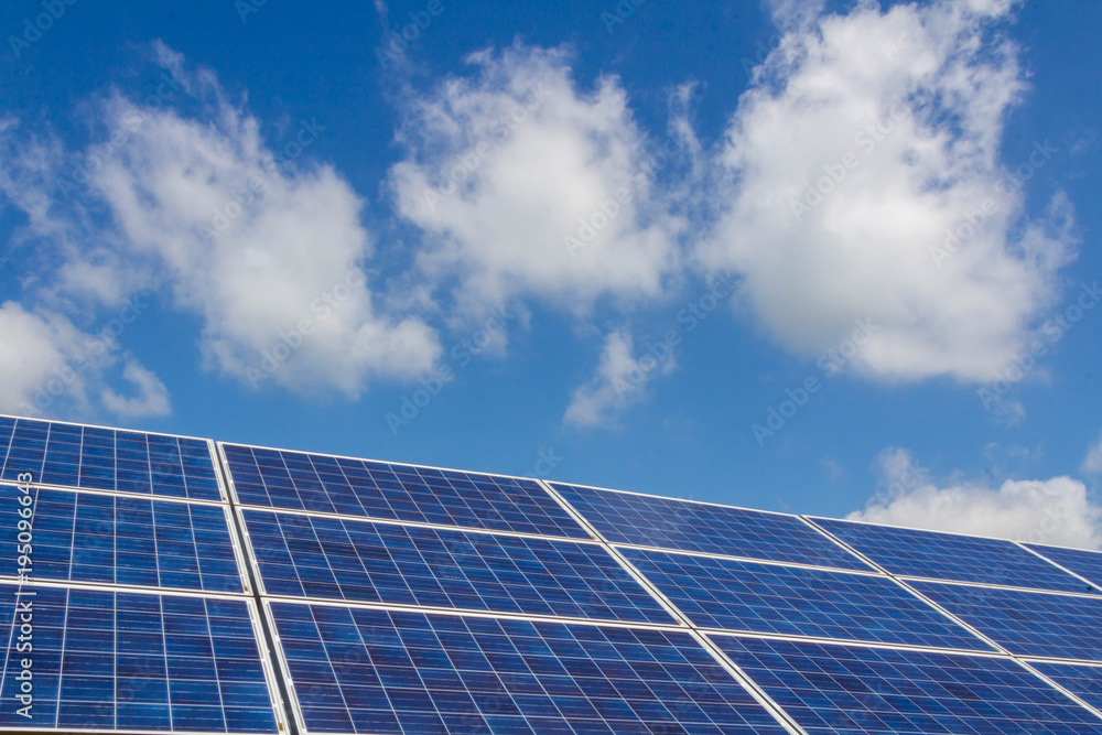 The solar panel tracking system with cloud and blue sky The solar panel tracking system with cloud and blue sky
