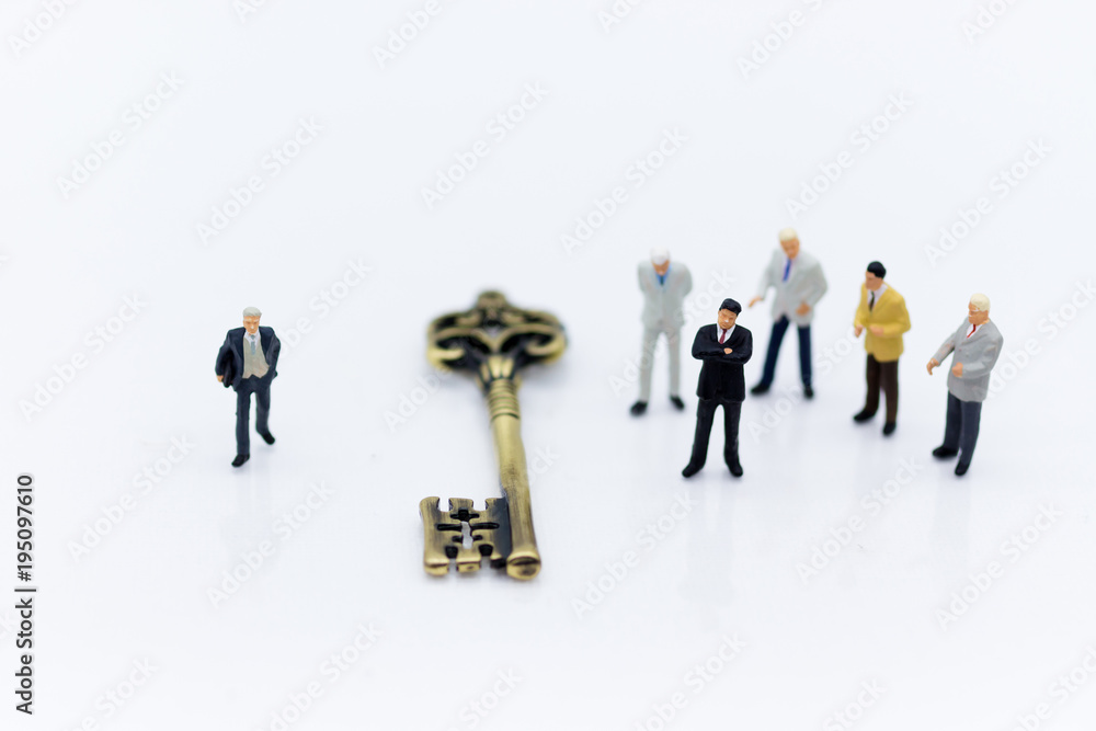 Miniature people: Group Businessmen stand with master key. Image use for key man, the key to success, business concept. Miniature people: Group Businessmen stand with master key. Image use for key man, the key to success, business concept.