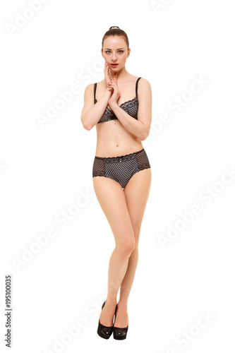 Confused girl in lingerie on white background