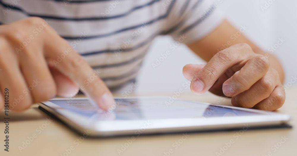 Man use of tablet computer at home Man use of tablet computer at home