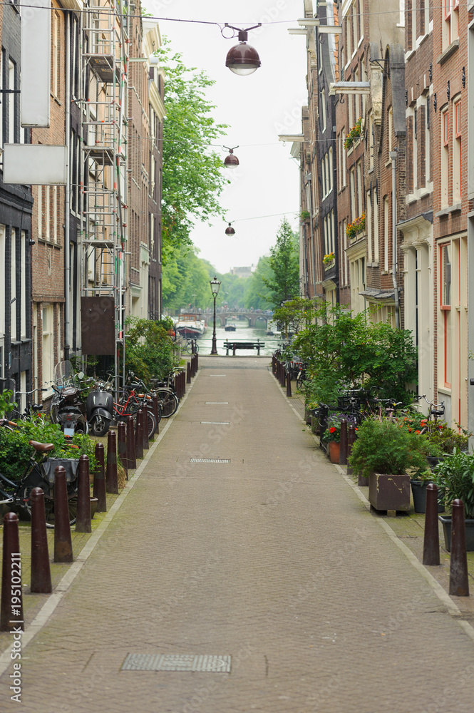 Traditional view on dutch houses and town street in summer day. Netherlands
