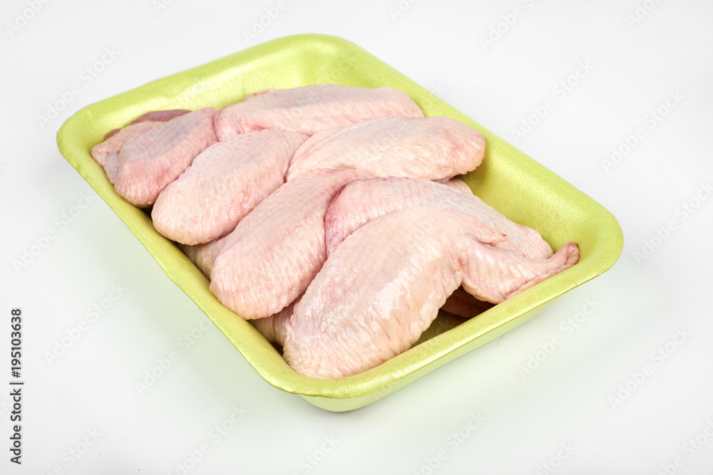 raw chicken wings package isolated on white background raw chicken wings package isolated on white background