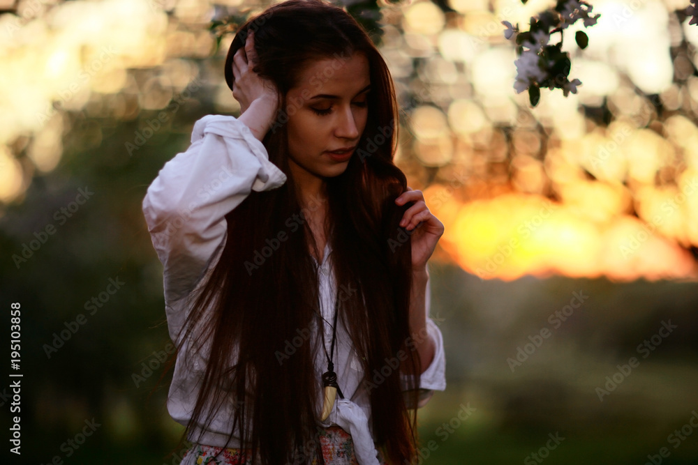Summer sunny park portrait of a beautiful young woman Summer sunny park portrait of a beautiful young woman