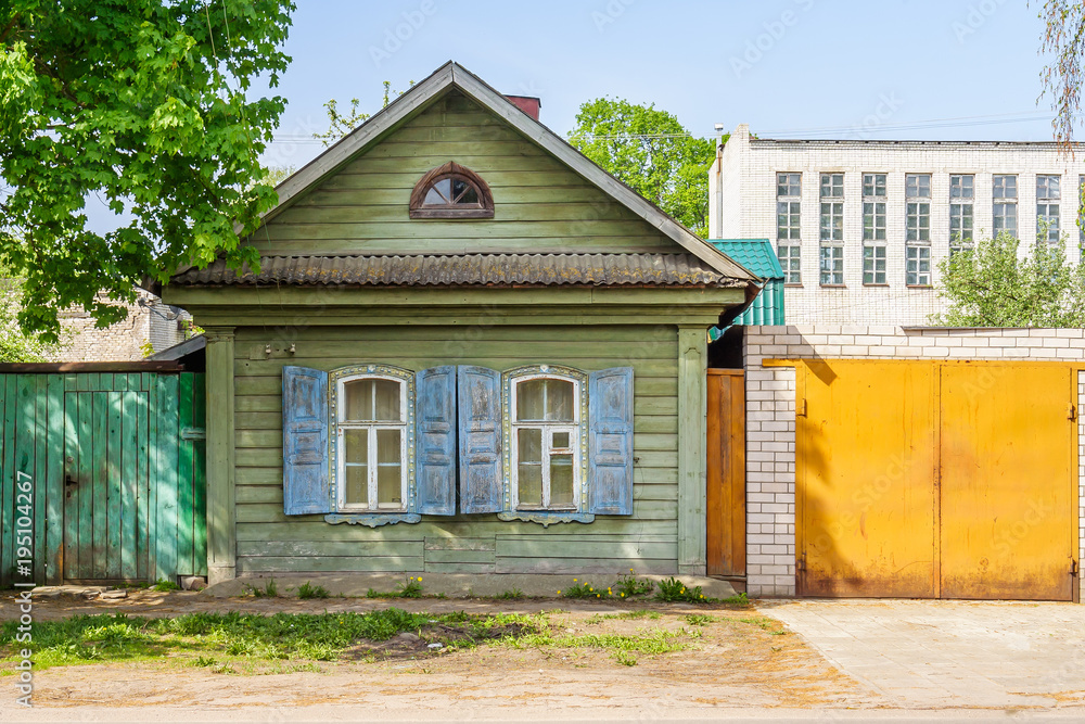 Small wooden house in the city Small wooden house in the city
