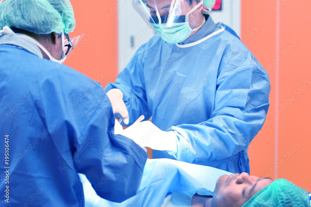 Team surgeon at work on operating room in hospital Team surgeon at work on operating room in hospital