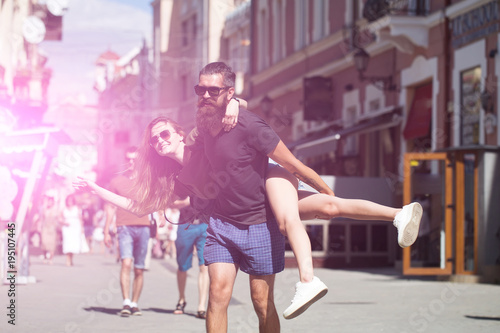Man giving piggyback ride to girlfriend © Volodymyr
