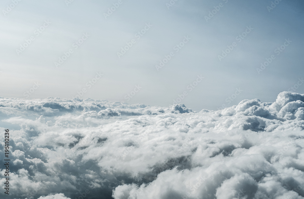 Blanket of fluffy clouds seen from a Piper Seneca III