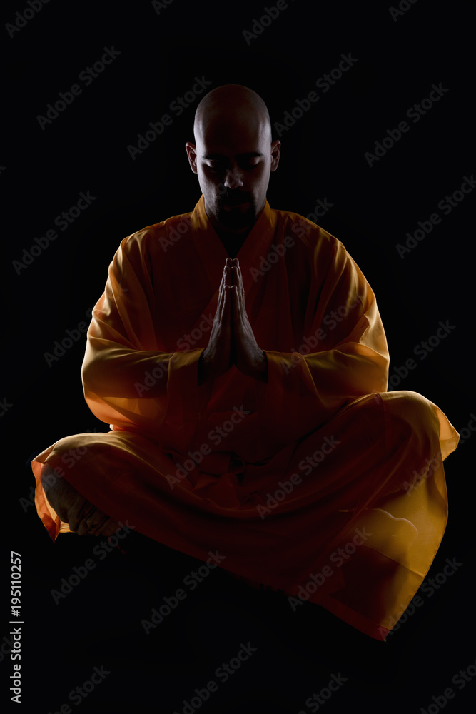 Foto Stock Shaolin monk meditating | Adobe Stock