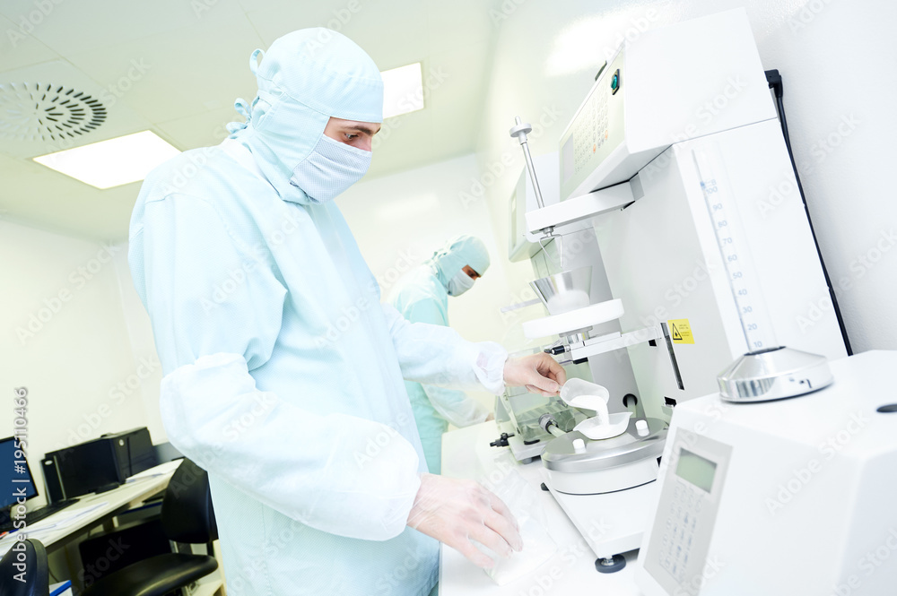Pharmaceutical researcher working with granulate and powder flow Pharmaceutical researcher working with granulate and powder flow