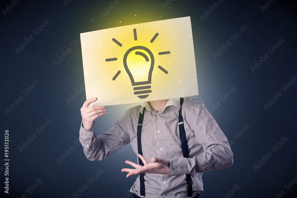 Businessman holding paper with lightbulb Businessman holding paper with lightbulb