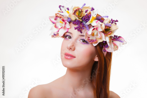 portrait of a young redhead girl with flower wreath