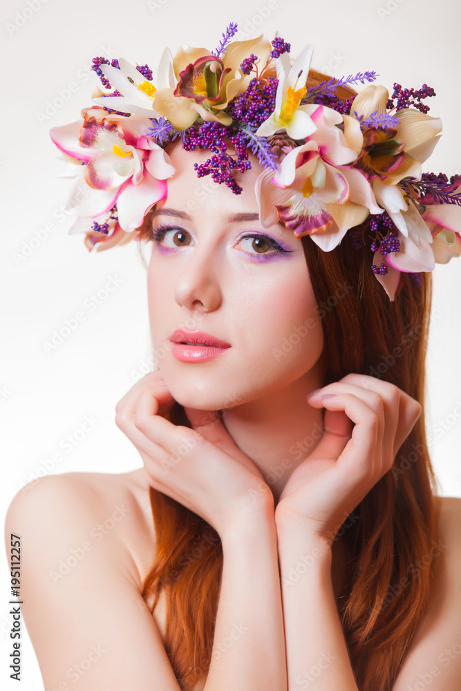 portrait of a young redhead girl with flower wreath