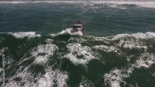 coast guard boat getting crushed by wave, rough seas, rouge wave crashing over boat agitated water, Drone aerial video, 4k, rescue, marine, pacific, tide, surge, danger, dangerous waves raw photo