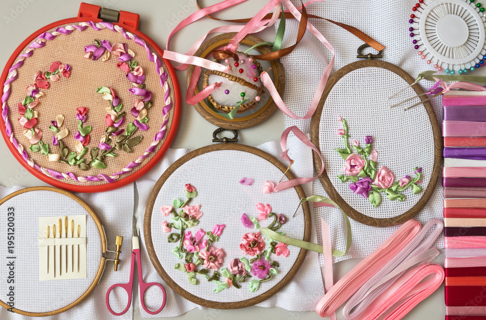 Naklejka premium Needlework. Embroidery with satin ribbons of floral compositions in a pink gamma