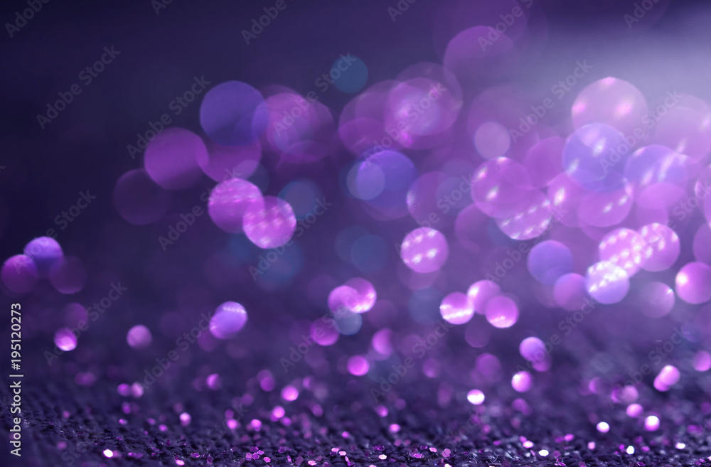 Sparkling Glitter abstract background dark purple saturated color ,de-focused, macro. Sequins fall and sparkle, round bokeh.