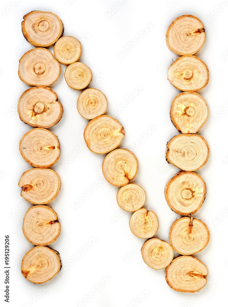 Alphabet letters made from Wood slice on white Background.N. Alphabet letters made from Wood slice on white Background.N.