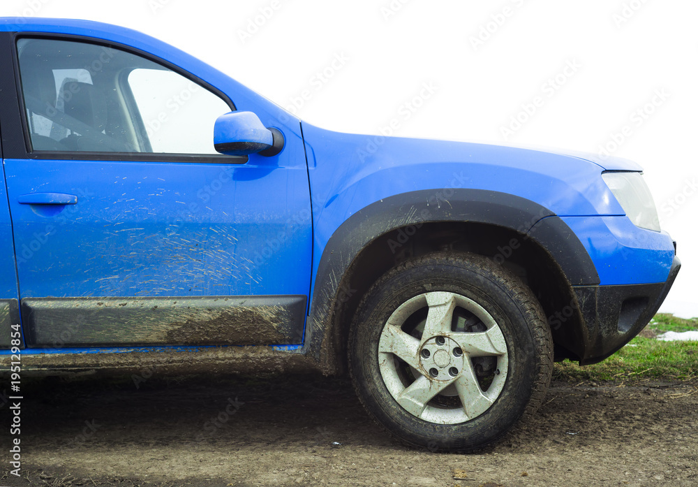 dirty blue car full of mud
