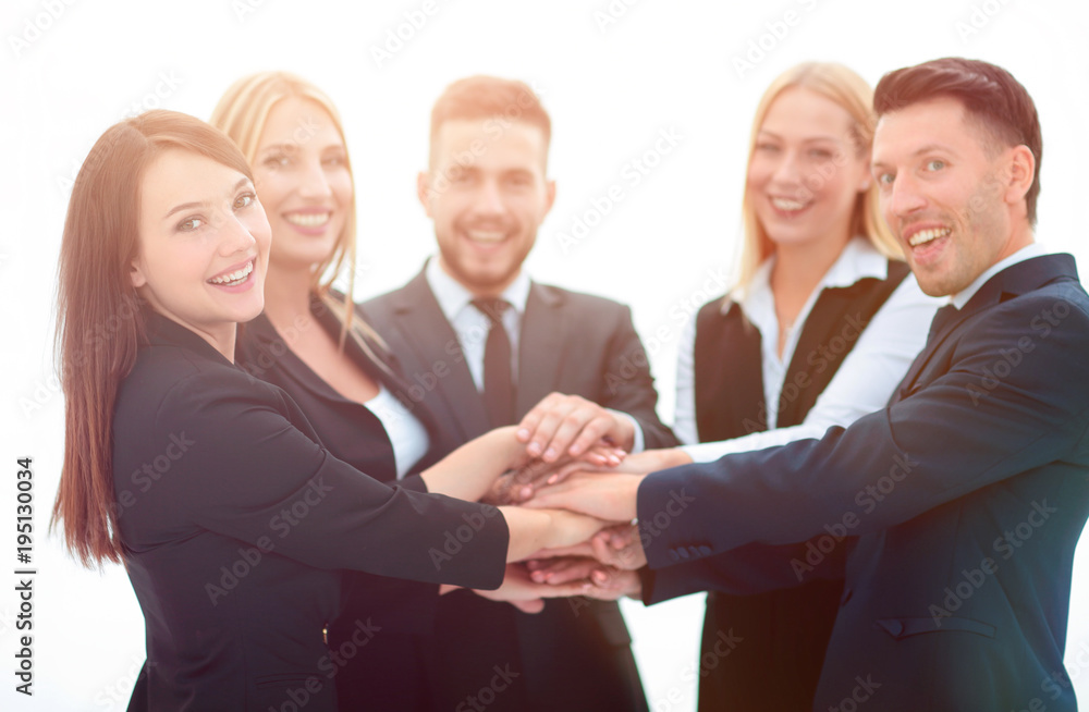 closeup.smiling business team with hands clasped together