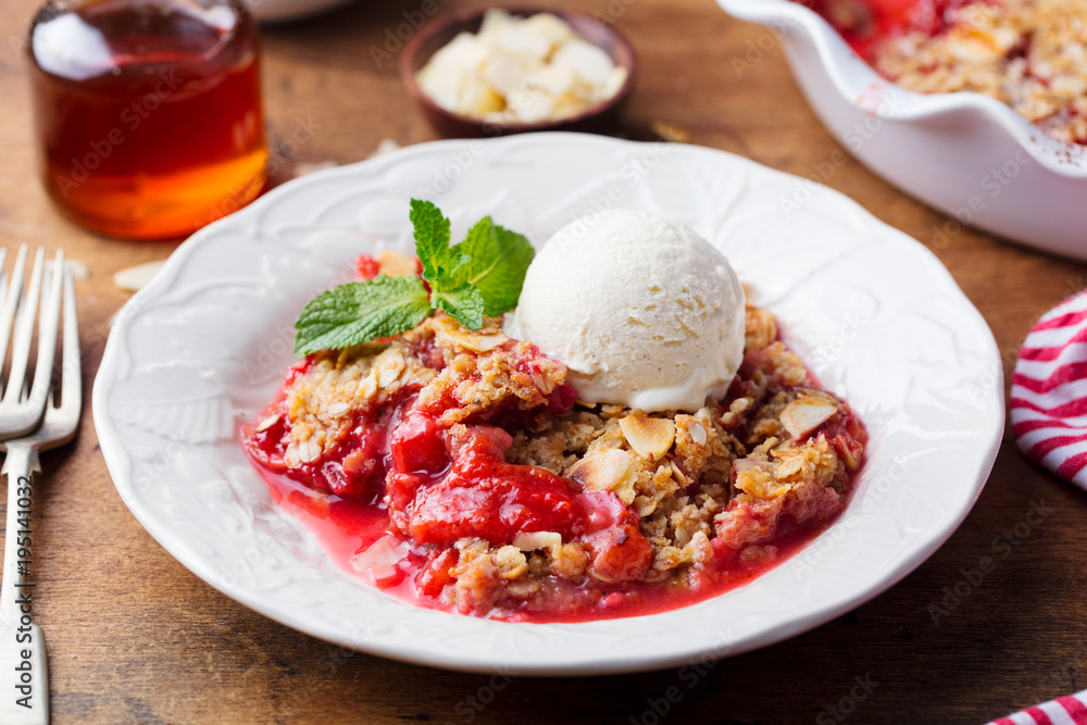 Crumble with berries and fruits with vanilla ice cream. Crumble with berries and fruits with vanilla ice cream.