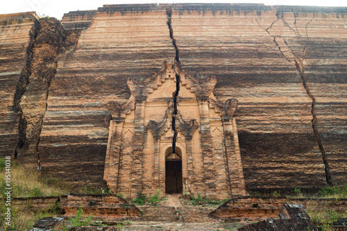 Western side of the ruins of the uncompleted Mingun Pahtodawgyi monument stupa in Mingun near Mandalay in Myanmar (Burma).