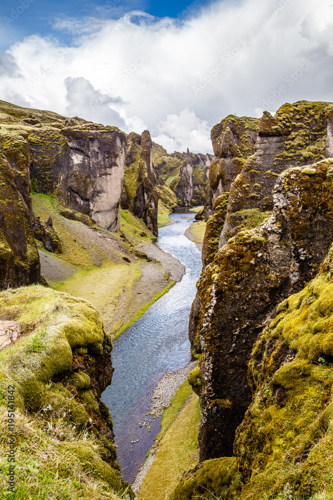 Fjadrargljufur canyon steep cliffs and waters of Fjadra river, south Iceland