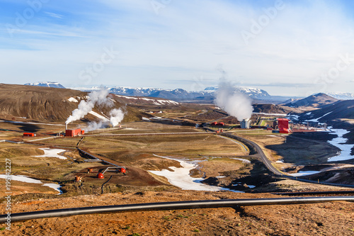 Icelandic landscape with geothermal power plant station and pipes in the valley, Myvatn lake surroundings, Iceland