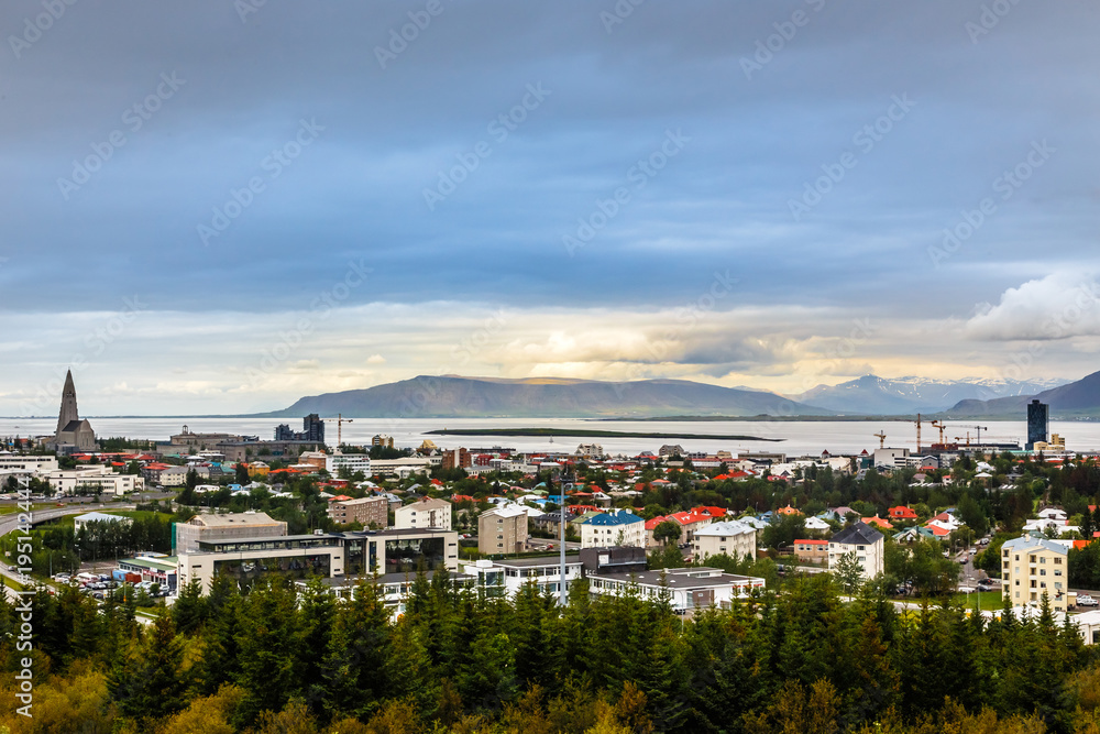 Icelandic capital panorama, streets and resedential buildings with fjord and mountains in the background, Reykjavik, Iceland