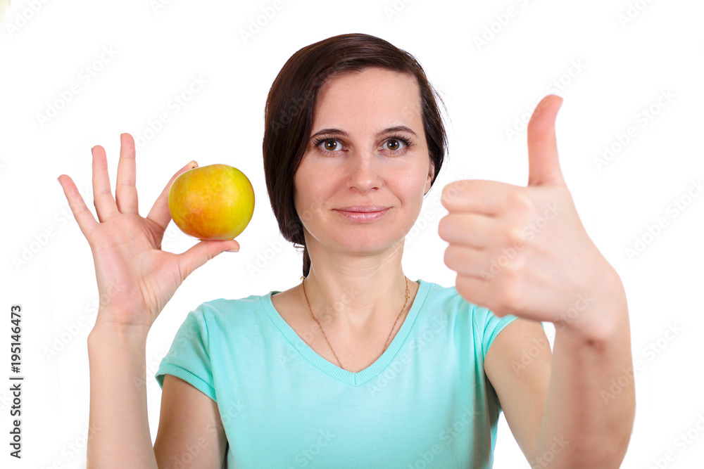 The girl holds with hand fingers apple