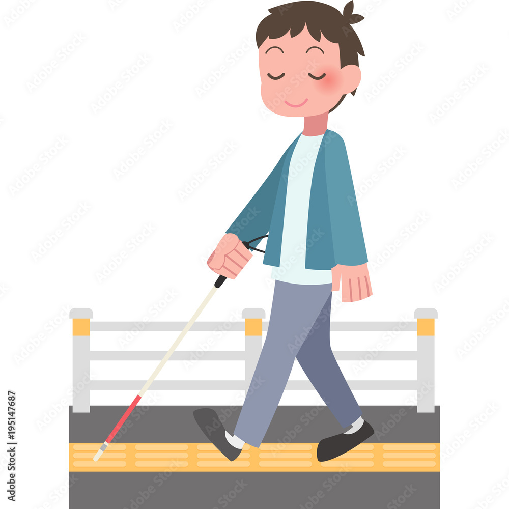 白杖をついて歩く男性