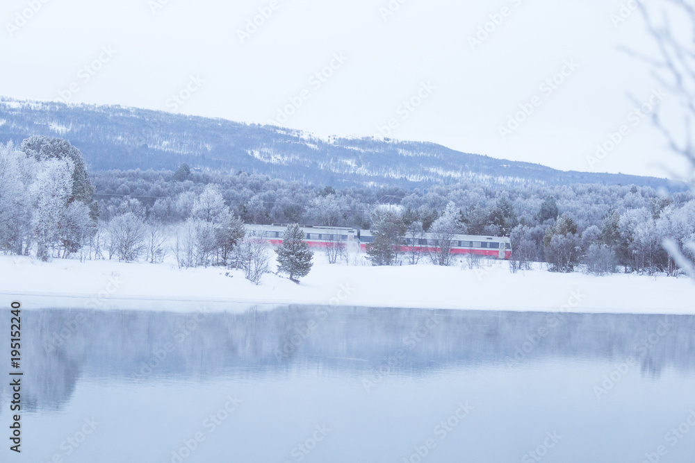 Beautiful frozen river with a trees on a bank. White winter landscape of central Norway. Light scenery. Beautiful frozen river with a trees on a bank. White winter landscape of central Norway. Light scenery.