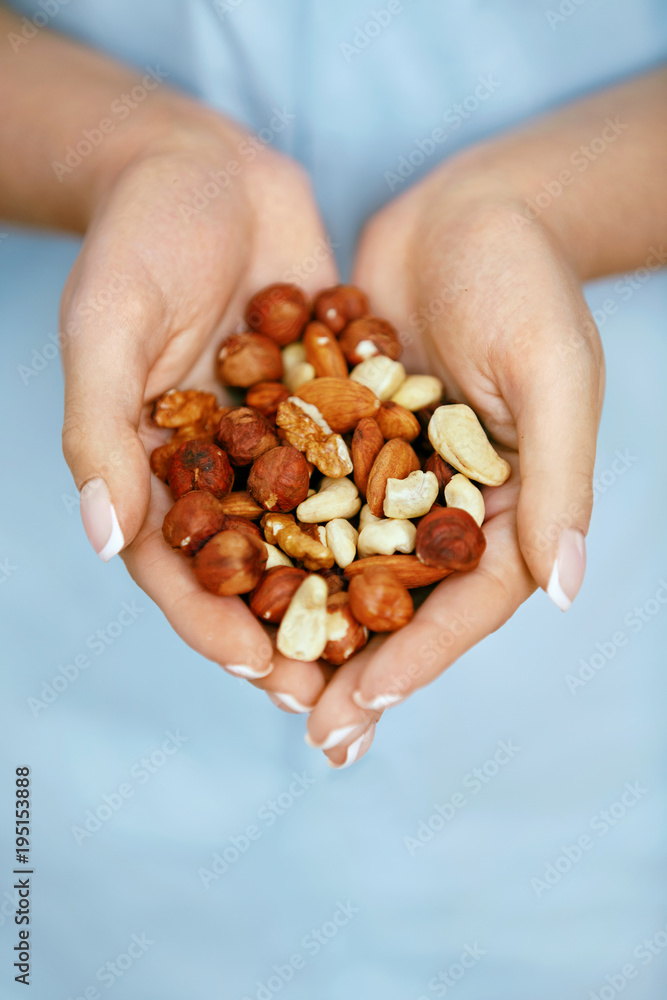 Nuts In Hands. Woman Hands Holding Healthy Food Nuts In Hands. Woman Hands Holding Healthy Food
