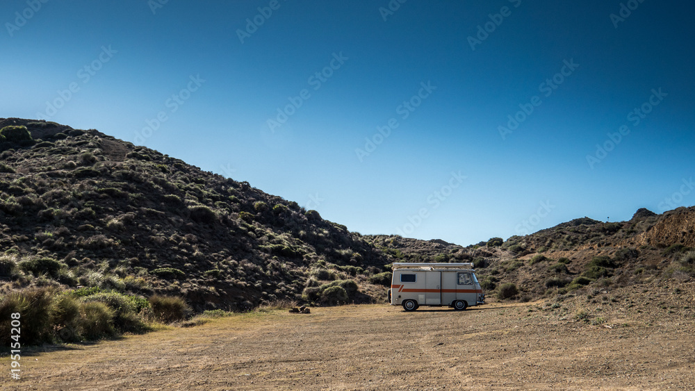 Small camper parked in a scenic location