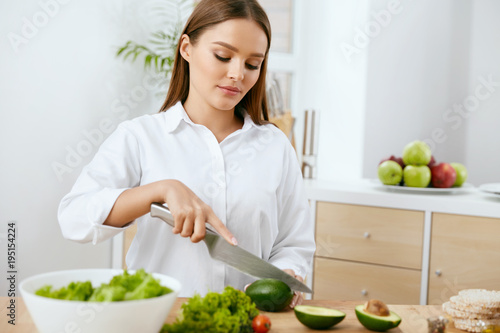 Nutrition. Woman Cooking Healthy Food In Kitchen.