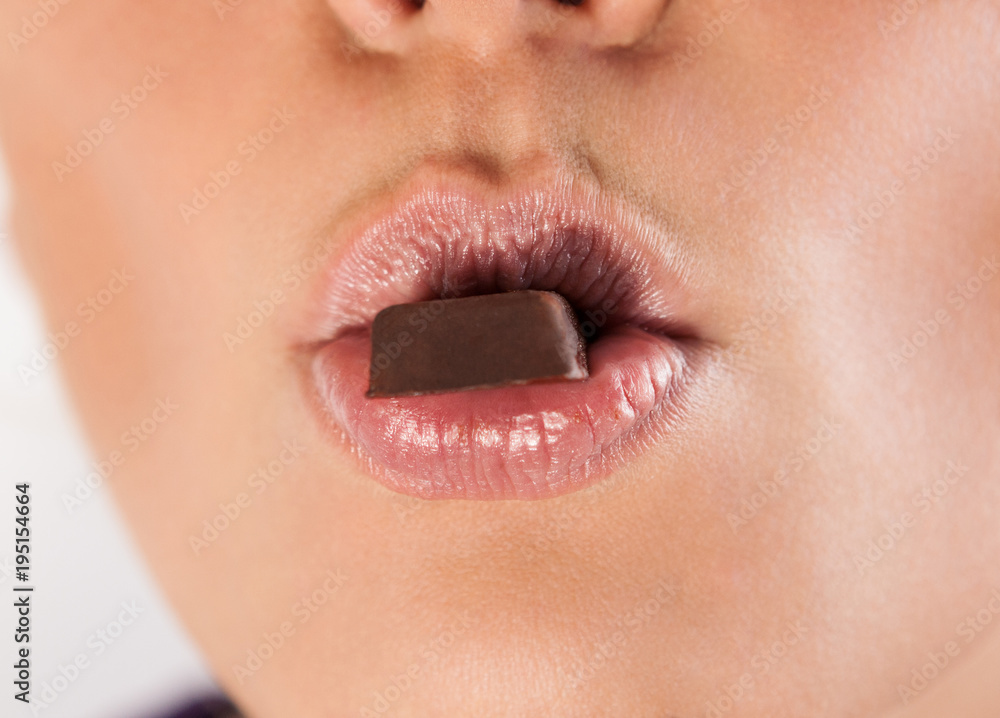 Naklejka premium Woman lips and chocolate