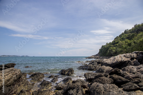 Rocky shoreline and blue sky