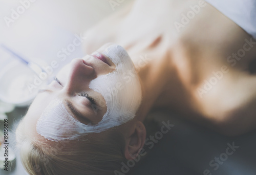 Wallpaper Mural Face mask.Beautiful young girl at spa ,cosmetician woman applying facial mask Torontodigital.ca