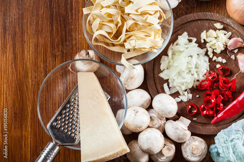 Ingredients ready for prepare tagliatelle pasta with champignon