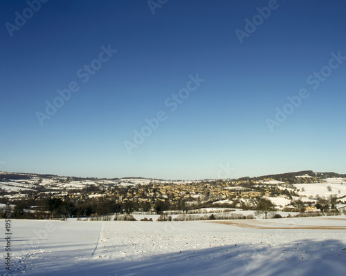 England, Gloucestershire, Cotswolds, winter view of Painswick in snow