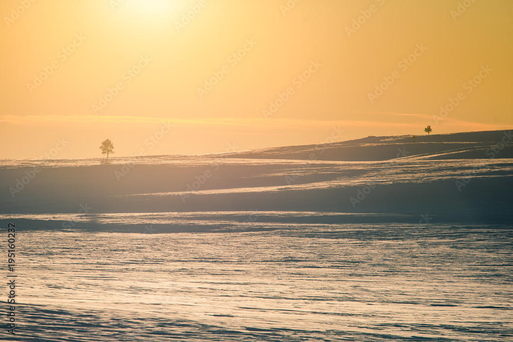 A beautiful colorful winter sunset in a central Norway. Warm evening light over the mountains.