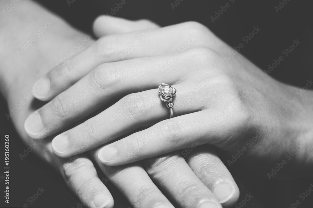 closeup the wedding beauty diamond ring on women ring finger, B&W filter applied