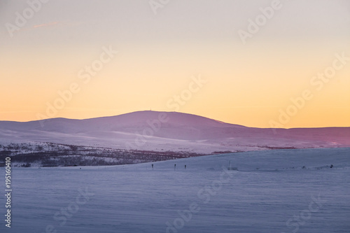 A beautiful colorful winter sunset in a central Norway. Warm evening light over the mountains.