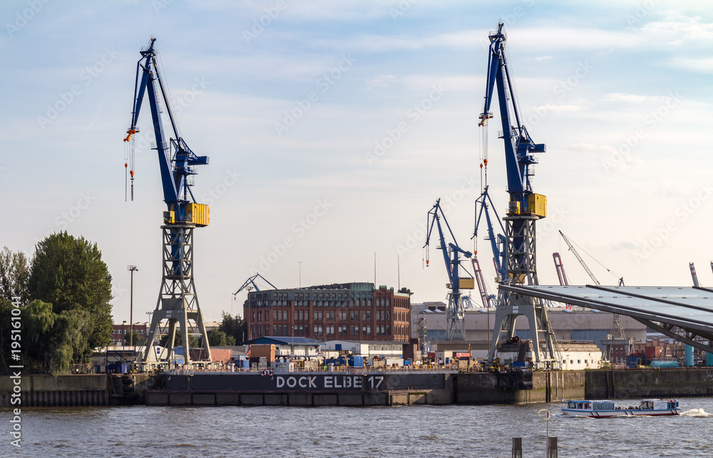 Big cranes at a dock in the port of hamburg