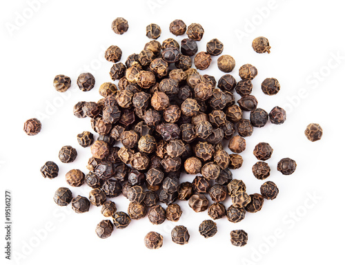 Black pepper. Heap of peppercorns isolated on white background. Macro. Top view.