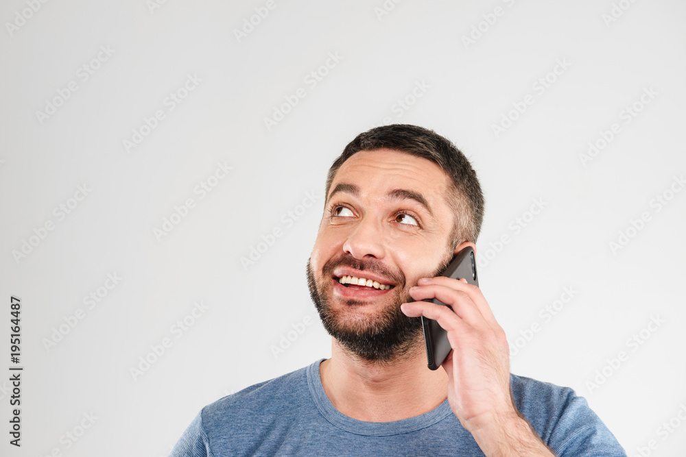 Cheerful man isolated talking by mobile phone. Cheerful man isolated talking by mobile phone.