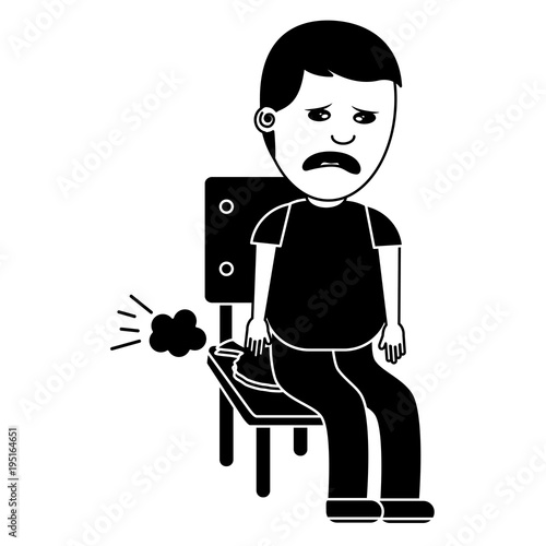 Foto sad man sitting in chair with whoopee cushion fools day