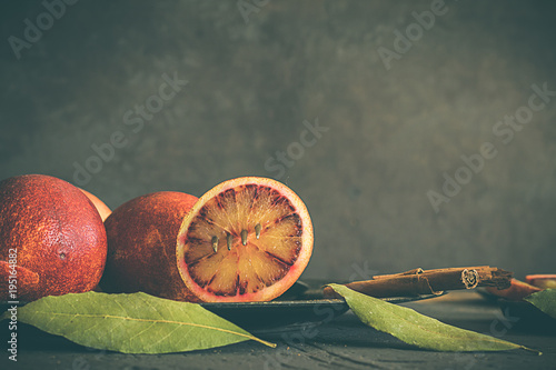 Bild auf Leinwand Blood oranges, on dark and rustic background