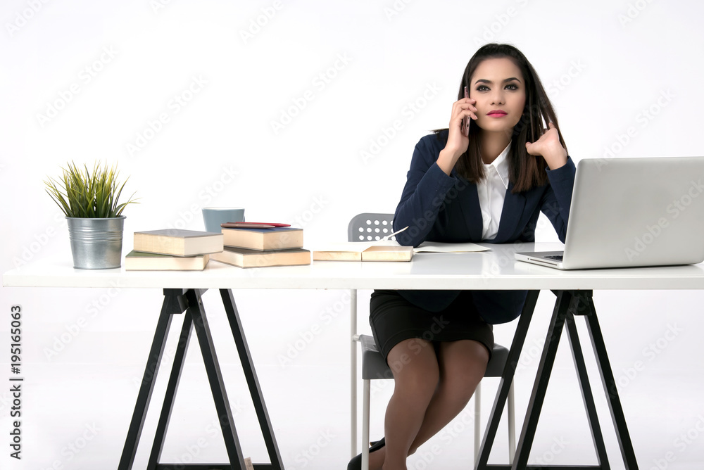 Beautiful office woman sit at table in office ,she work with laptop and use pen write report on notebook. Beautiful office woman sit at table in office ,she work with laptop and use pen write report on notebook.