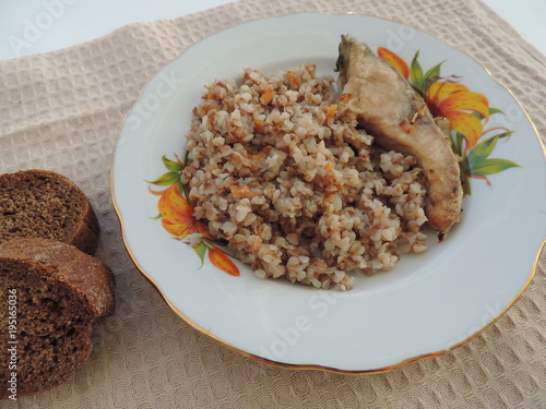 fried fish with buckwheat and tomatoes
