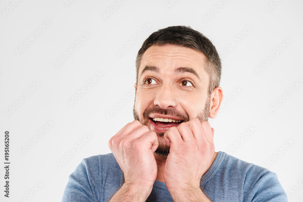 Excited young man standing isolated Excited young man standing isolated