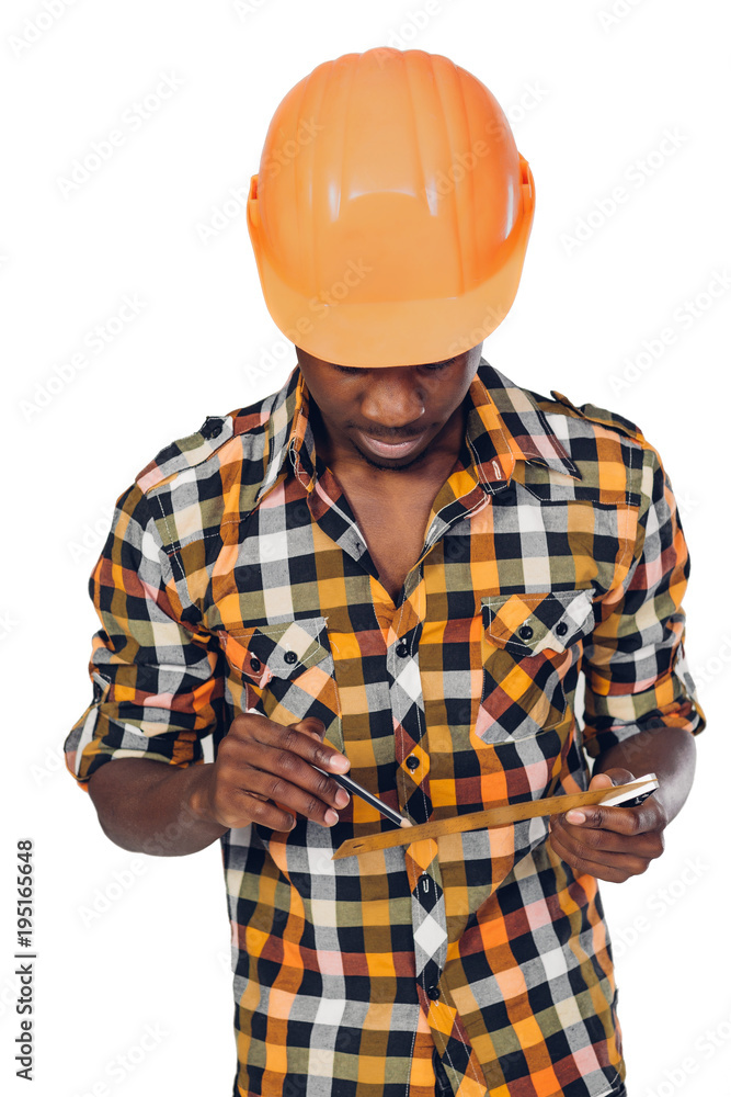African-American builder uses measuring tape African-American builder uses measuring tape